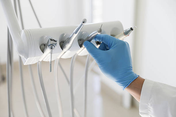 Professional Tooth Extraction technician working in Wixom, MI